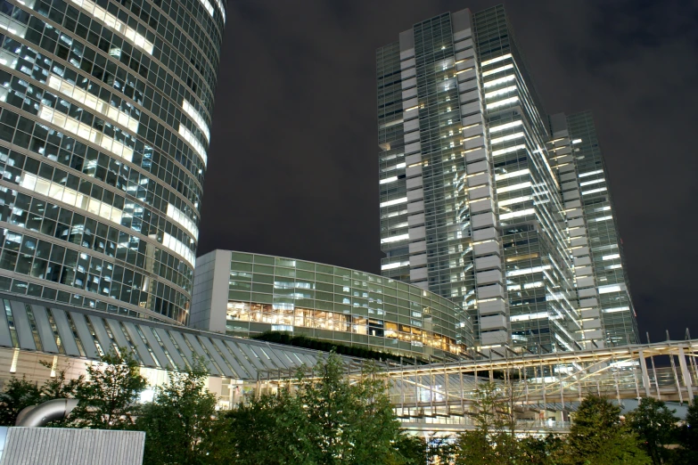 some very tall buildings next to each other at night