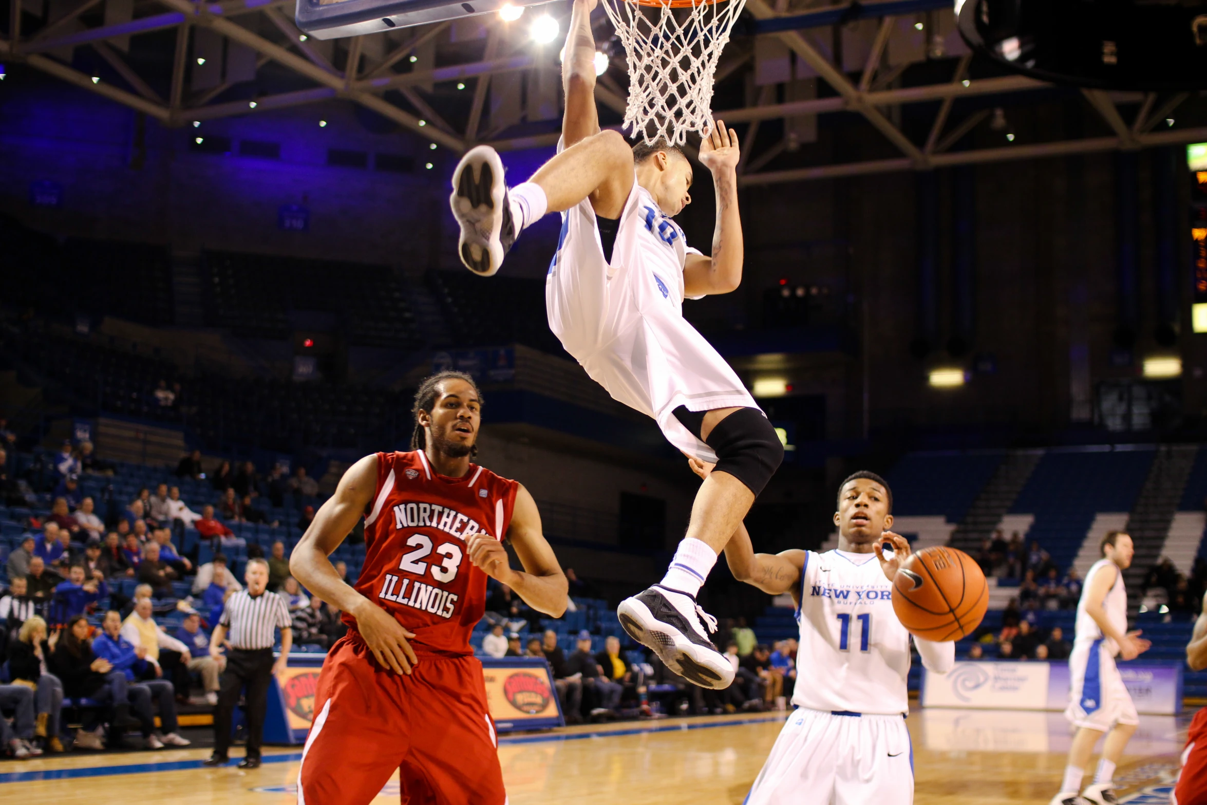 a basketball player goes to the basket during a game