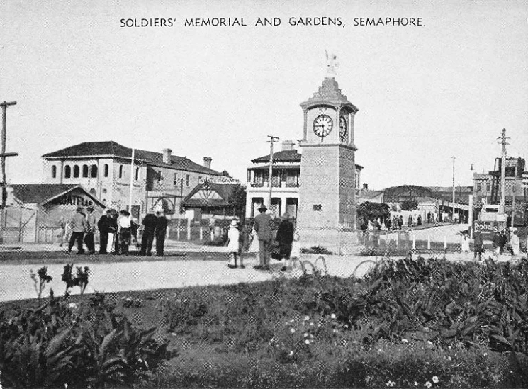 people standing outside in a town with the name soldier memorial and gardens, camppoint