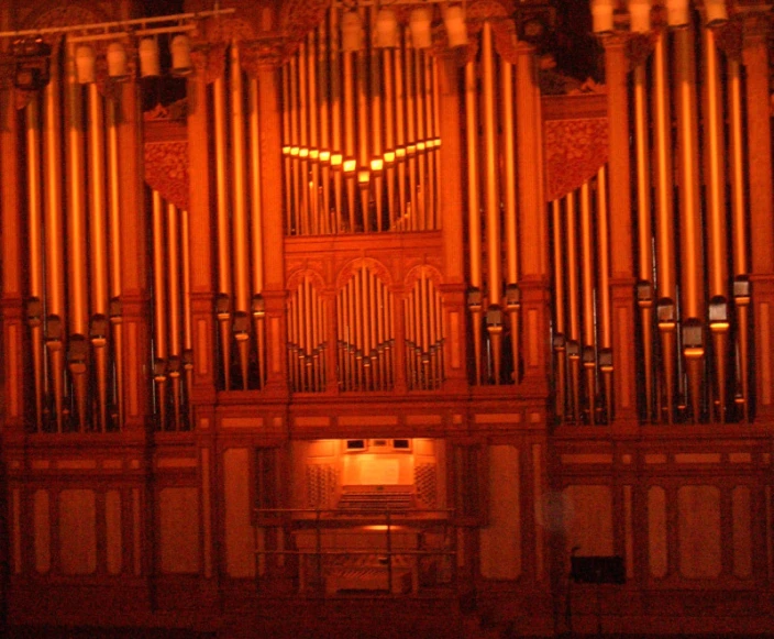 an organ inside of a cathedral with lights