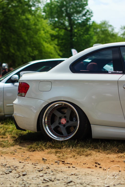 some white cars are parked beside each other