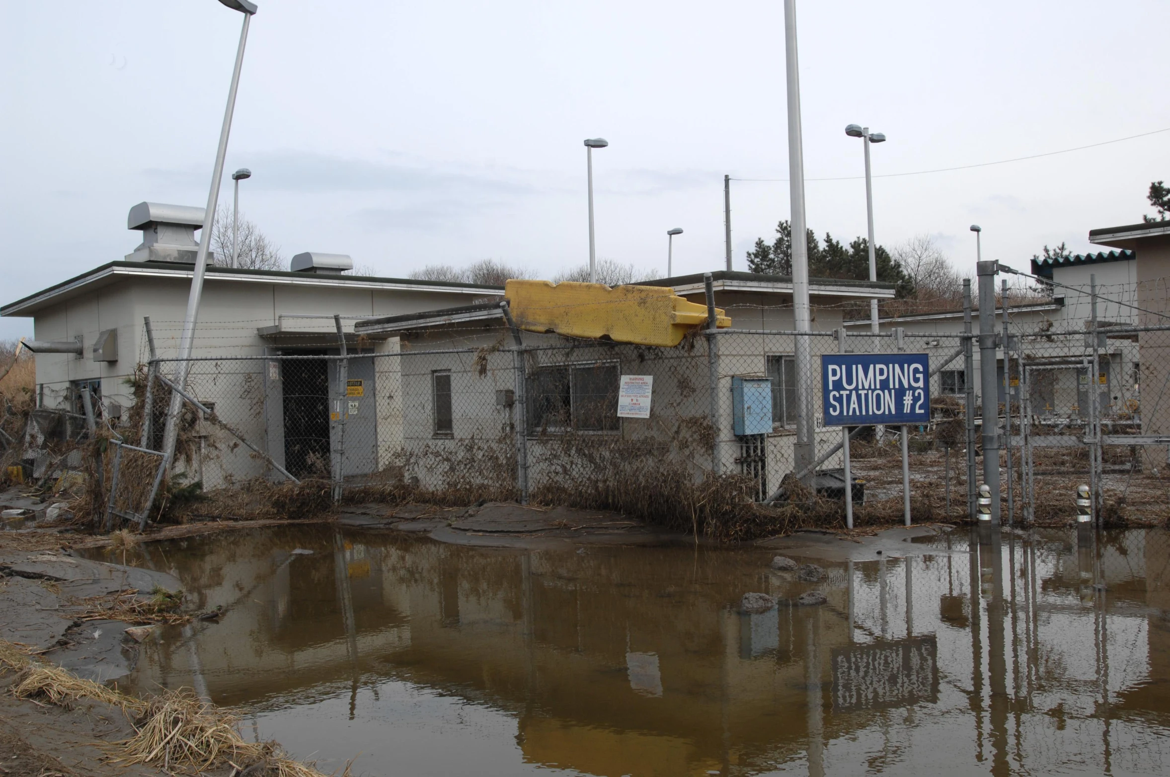 a building is surrounded by water in the street