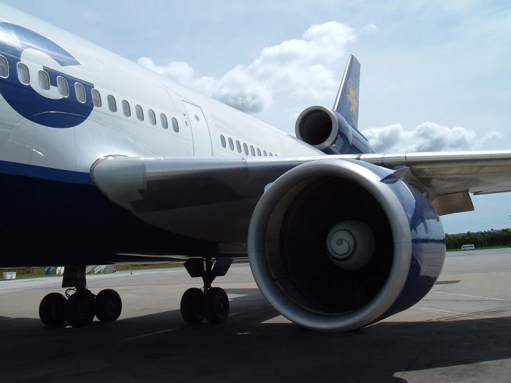 a large jetliner sitting on top of an airport tarmac