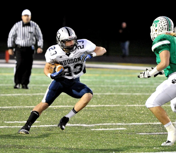 a football player running with the ball