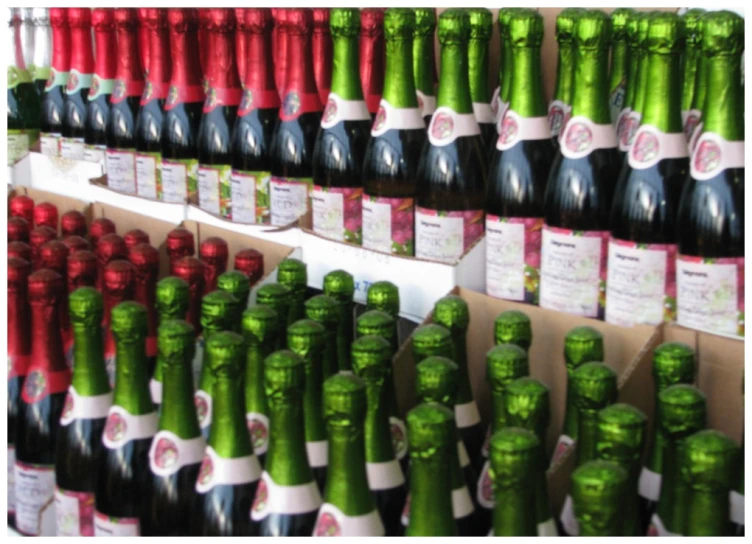 many wine bottles are displayed on a rack