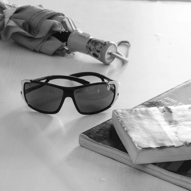 a pair of glasses and books on a table