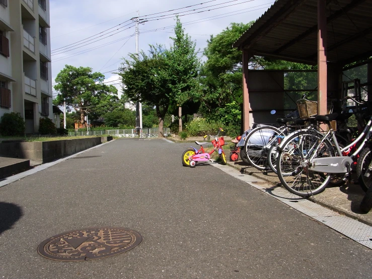 bikes parked on both sides of a street, with no traffic