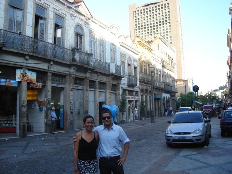 two people standing in the street together