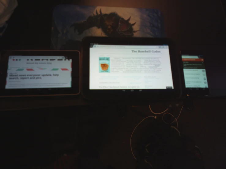 two screens are displayed on a desk top