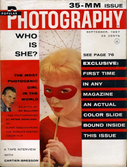 a magazine cover with a woman in red