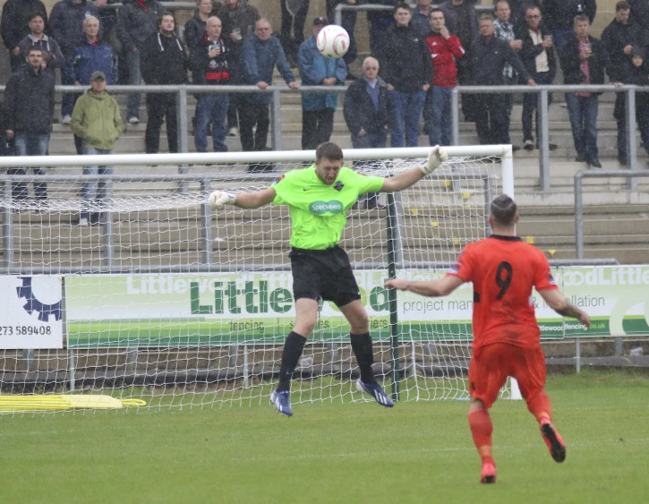 a soccer player hitting the ball during a game