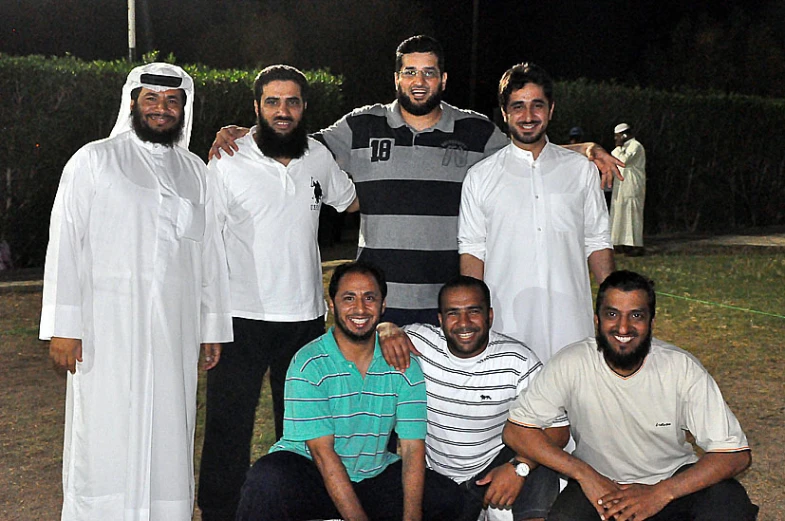 an image of a group of people with a flag in the background