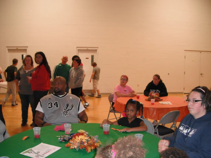a group of people sitting at tables at an event