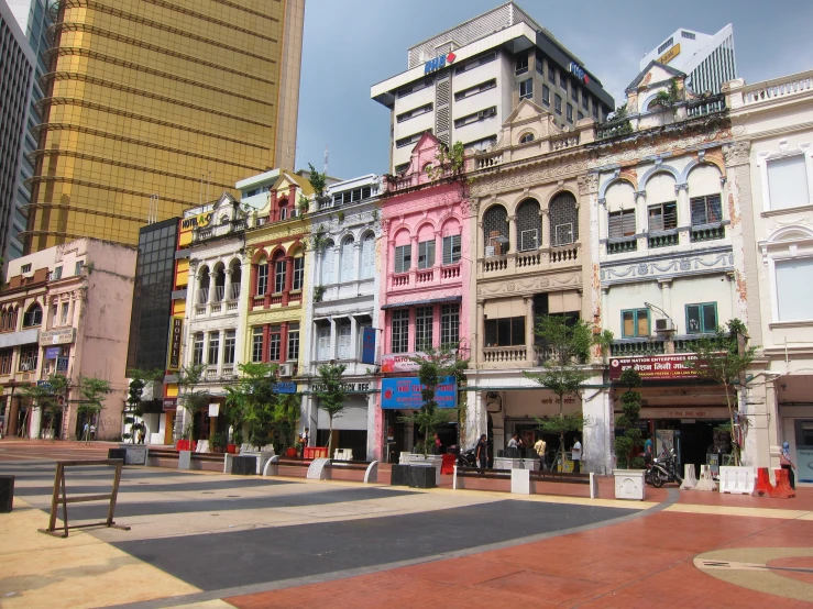 a group of buildings next to each other with a blue sky above