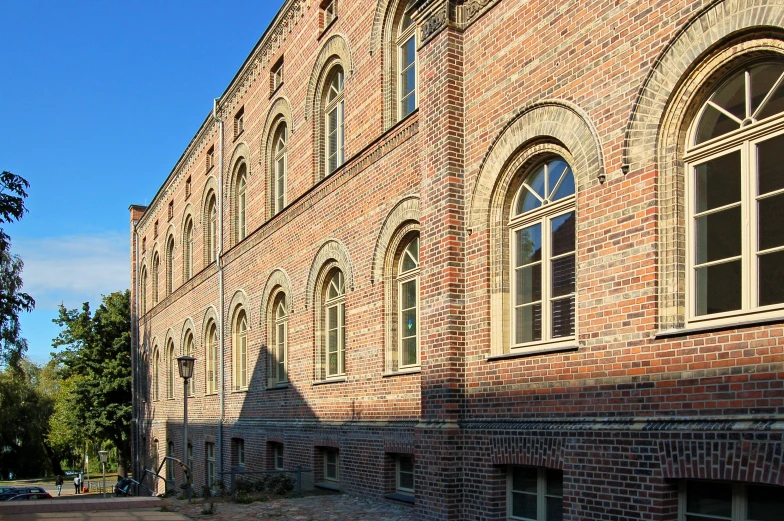 a red brick building with large arched windows