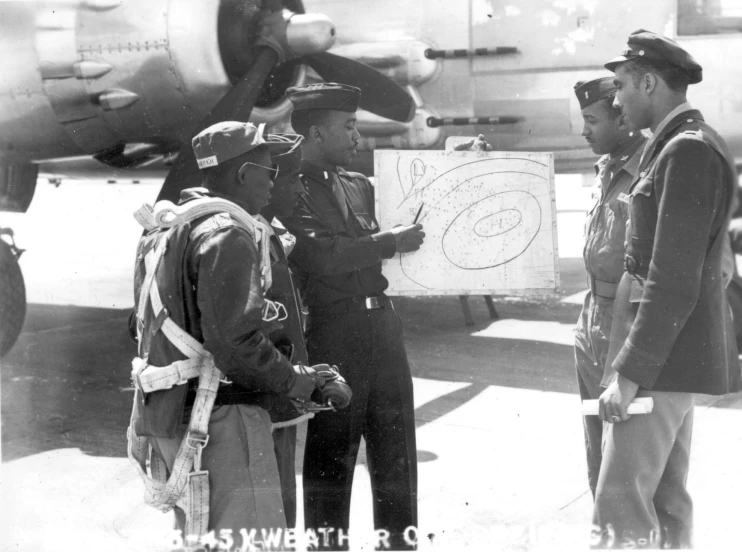 an old black and white po with military personnel