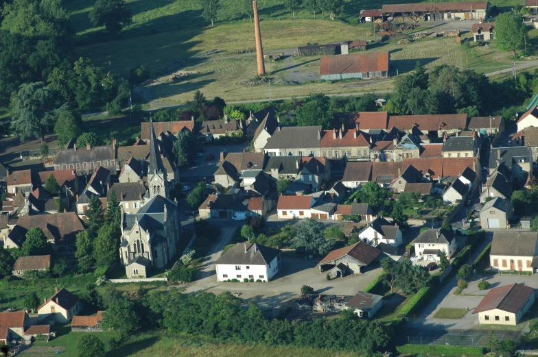 a residential area with buildings and lots of trees