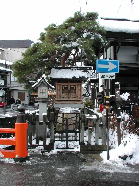 a snow covered residential area with street signs