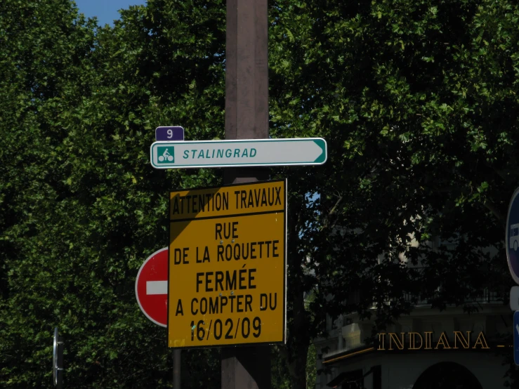 the street signs show a direction and a sign showing traffic