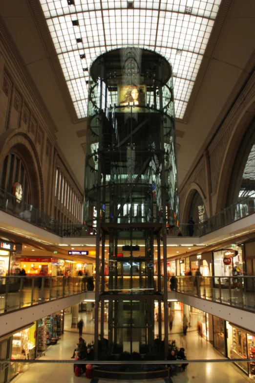 the inside of a shopping mall with lots of shops