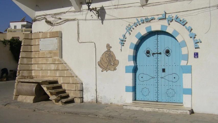 the entrance to a building with a blue door