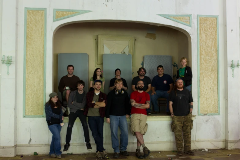 a group of young people standing on top of an arch