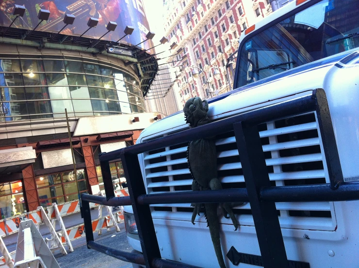 the front grille of a truck with an animal in its enclosure