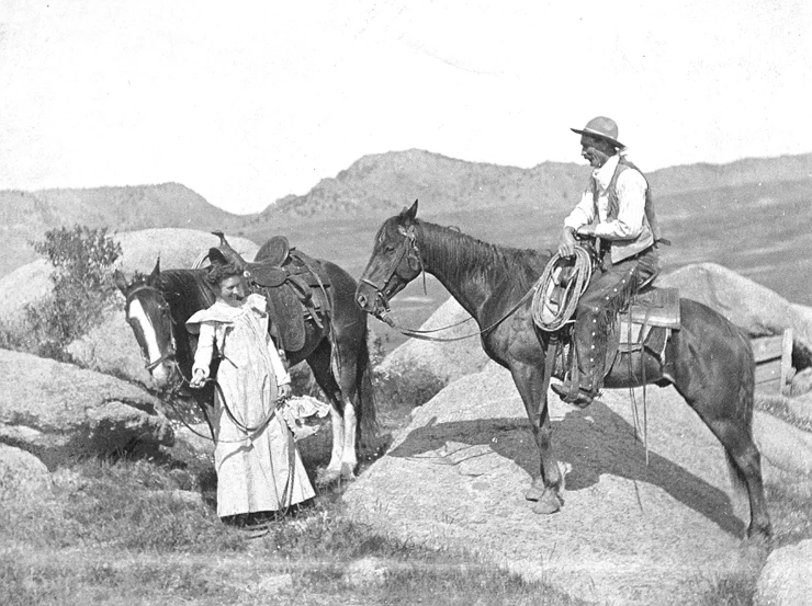 a man is on a horse with two women