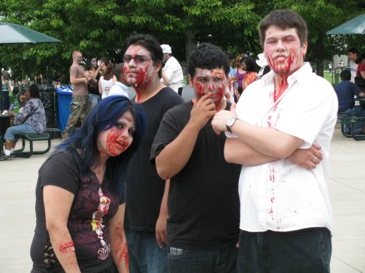 a group of people with face paint on their faces