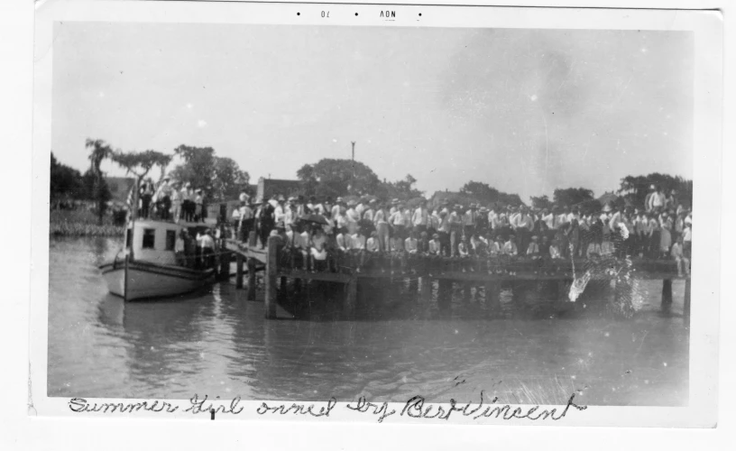 a large group of people are on a pier