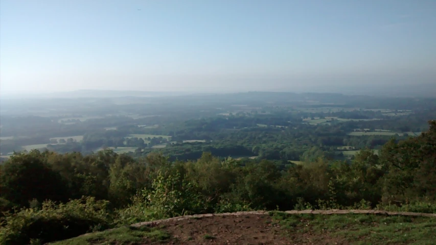 there is a hill in the distance, and a blue sky