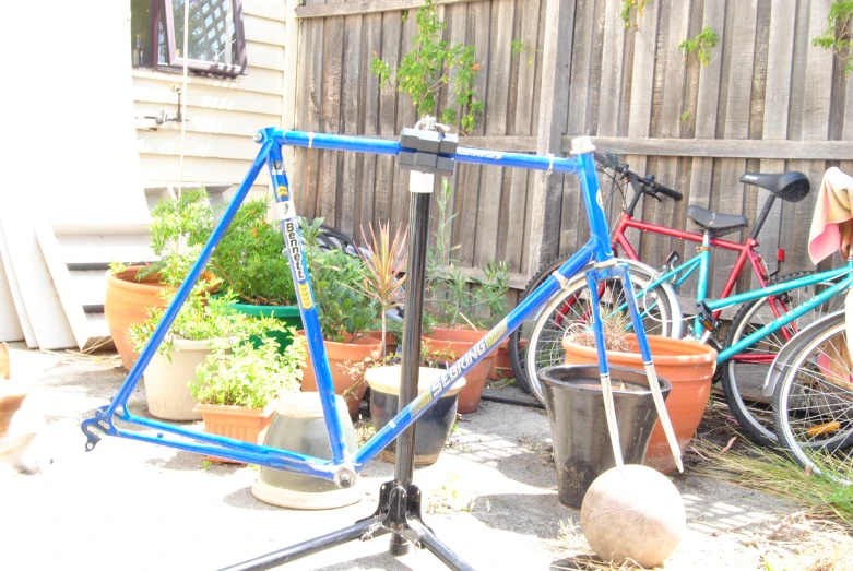 two bicycles that are sitting on some metal