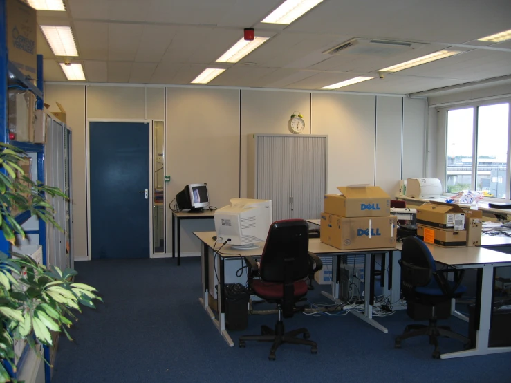 a po of an office with two desks and multiple computers