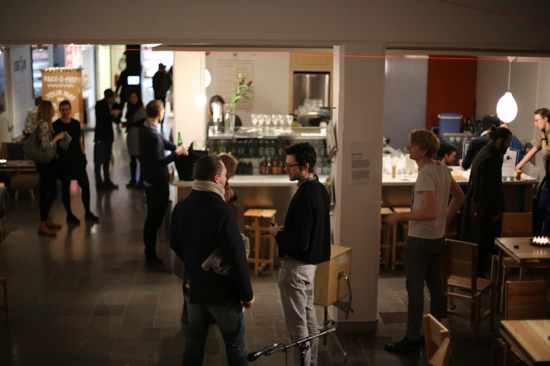 people wait in line at a coffee shop