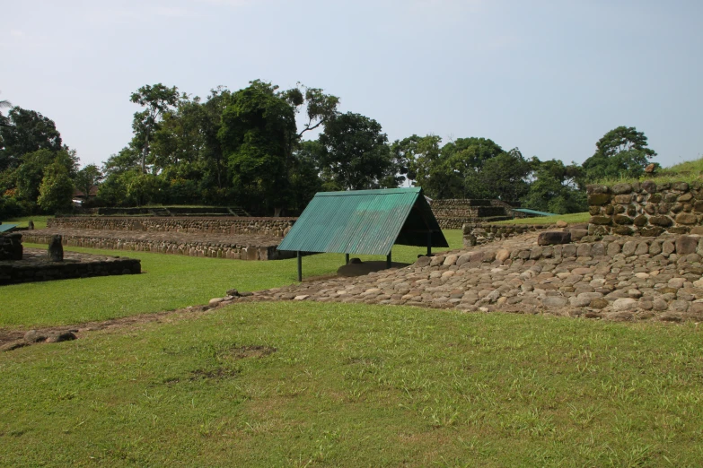 a view of the back of a building with a green roof