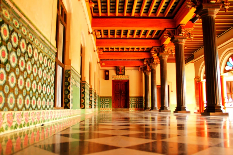 inside view of a building showing tiles and pillars