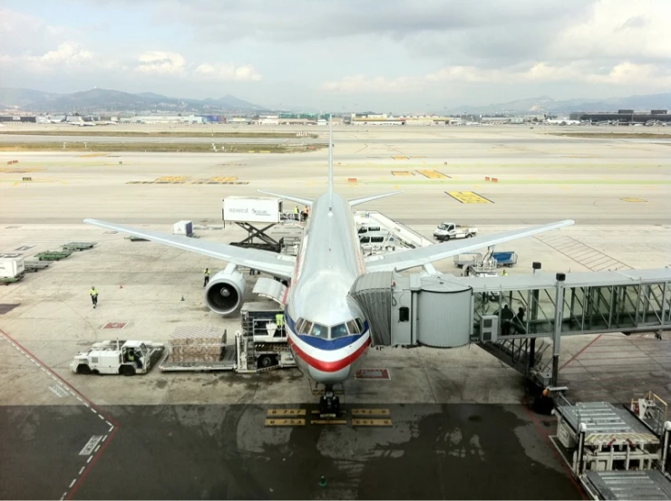 an airplane parked at a gate on the runway