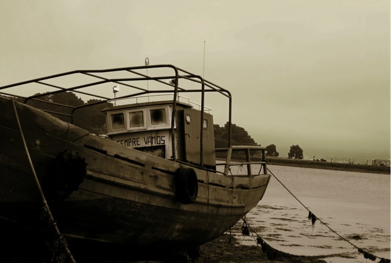 a black and white po of an old fishing boat