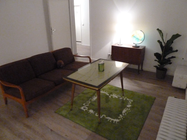 an open living room has a coffee table and rugs