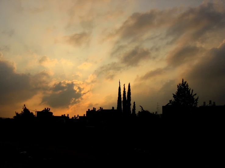 silhouetted church spires at sunset, looking towards the town