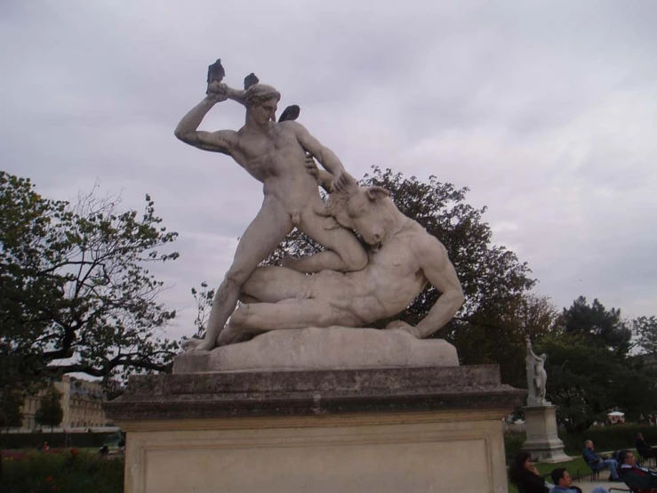 an ornate statue depicting a woman being hugged by a man