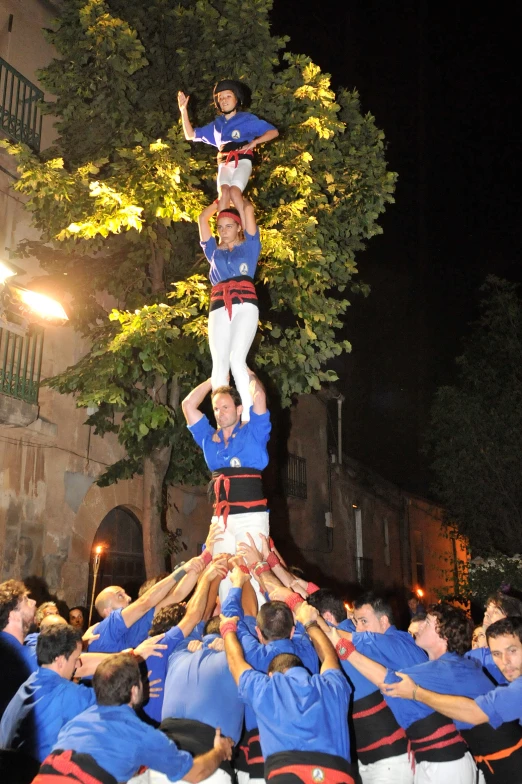 a group of people stacked on top of each other