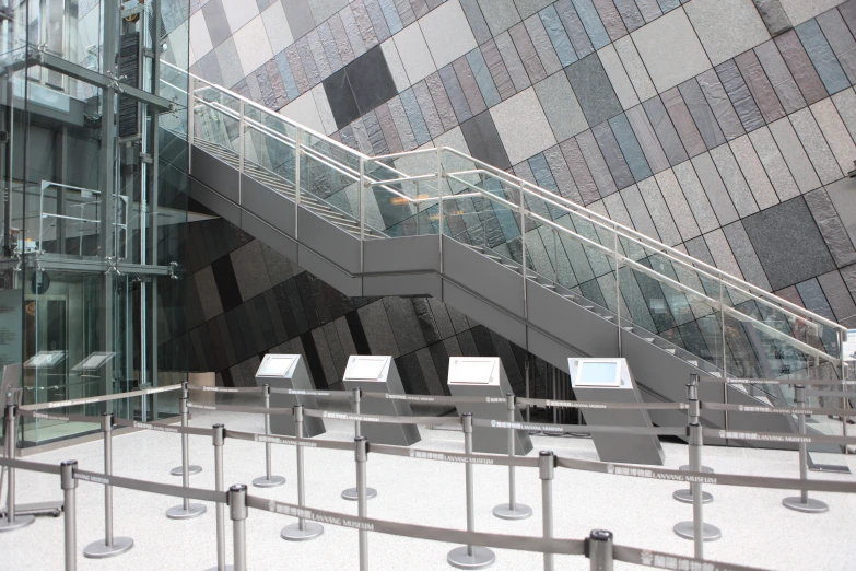 an escalator leading to a stair case