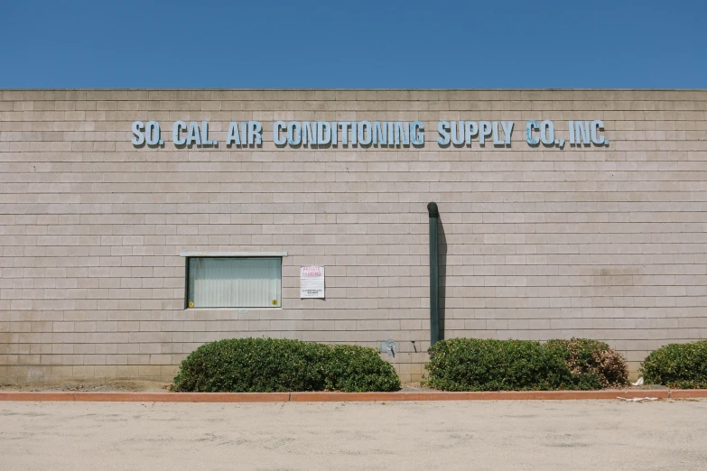 the front of a building with a clock near by