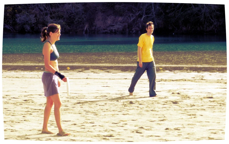 there are two young women on the beach together