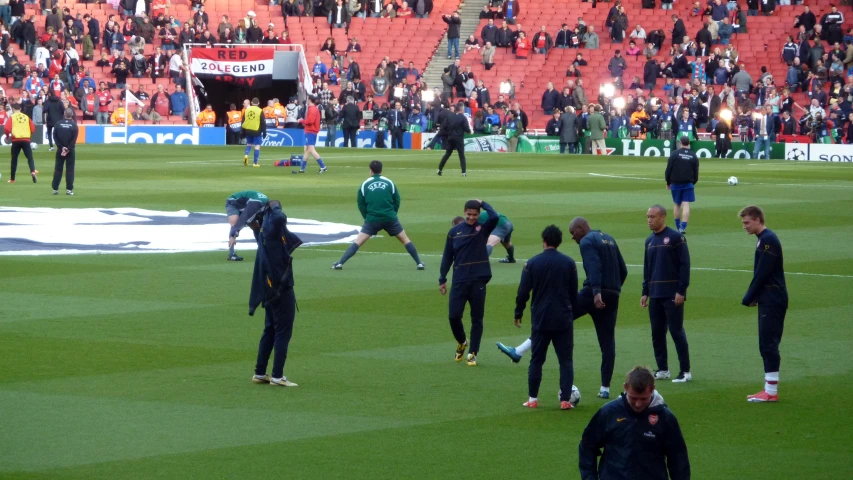 several soccer players warming up in the sun