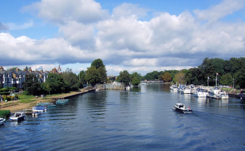 a row of small boats floating on a river