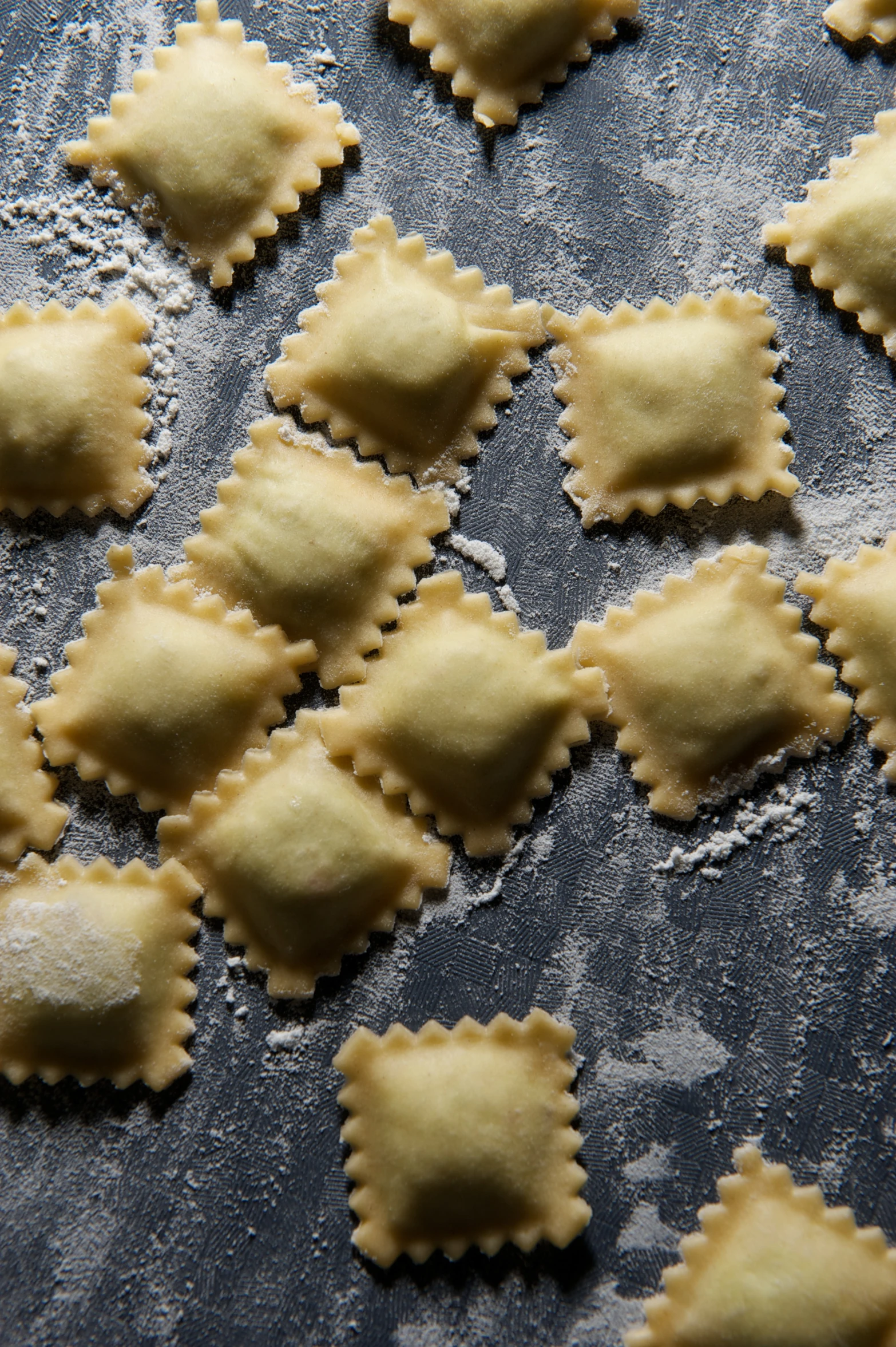 a number of small ravioli on a sheet