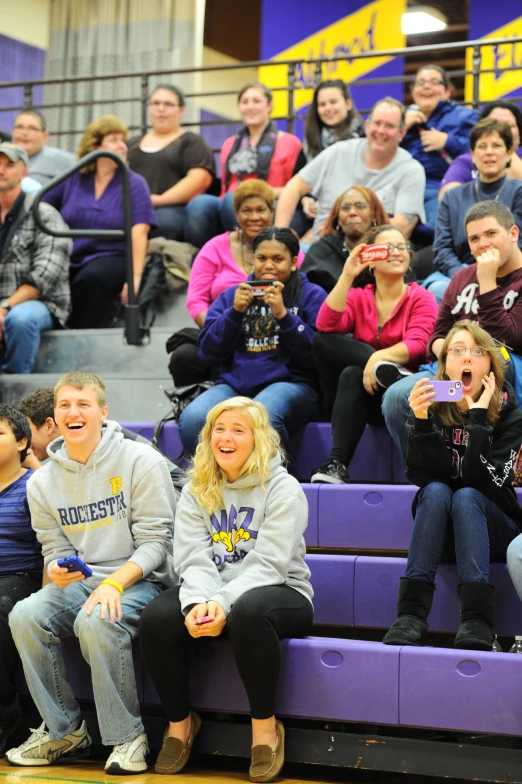 a group of people watching a game in front of an audience