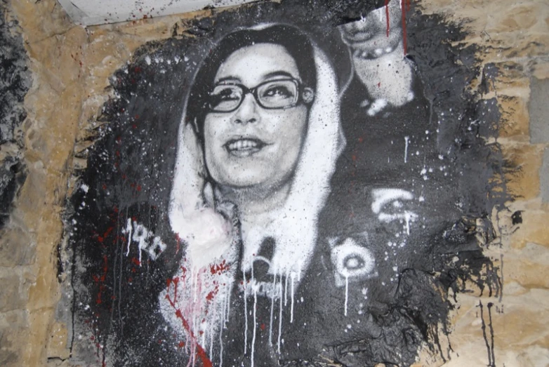 graffiti painting of a woman wearing glasses and an evil smirk